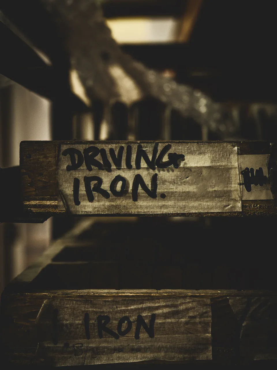 Wooden workshop boxes labelled Driving Iron and Iron