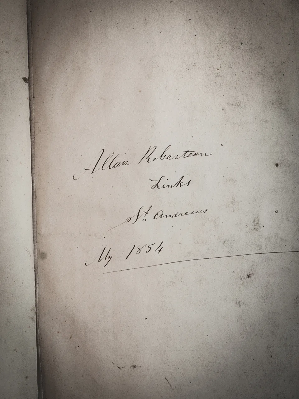 A handwritten inscription reading Allan Robertson, Links, St Andrews, 1854, on an aged album page